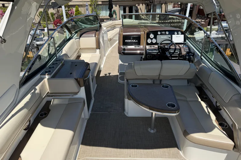 Slide: The Image of 2015 Formula 330 Crossover Bowrider interior with luxurious seating and modern dashboard. - 12
