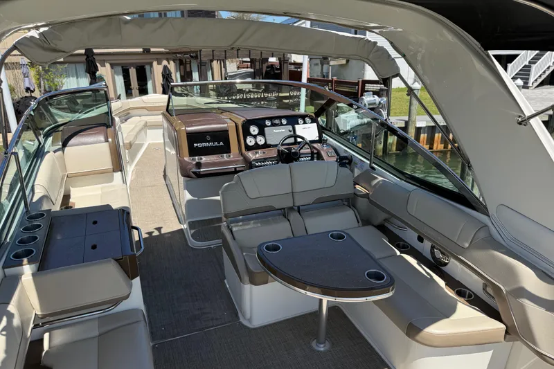 Slide: The Image of 2015 Formula 330 Crossover Bowrider interior with luxurious seating and modern dashboard. - 14