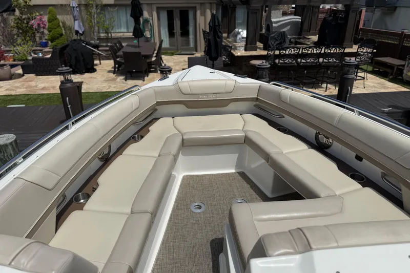 Slide: The Image of Luxurious seating on a 2015 Formula 330 Crossover Bowrider boat, showcasing spacious interior design. - 20