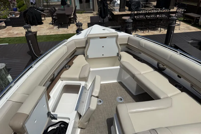 Slide: The Image of 2015 Formula 330 Crossover Bowrider with spacious seating and storage compartments. - 22