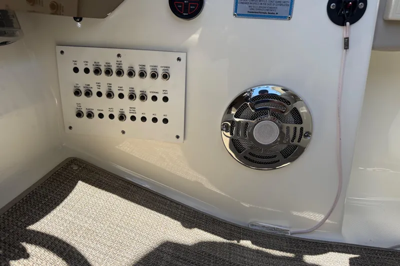 Slide: The Image of Control panel and speaker on a 2015 Formula 330 Crossover Bowrider boat. - 29