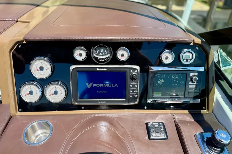 Slide: The Image of Dashboard of 2015 Formula 330 Crossover Bowrider with navigation and control systems. - 30
