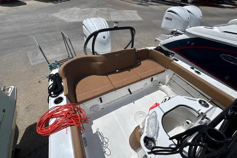 Slide: The Image of 2023 Sea Hunt Ultra 239 SE boat interior with seating and equipment. - 14