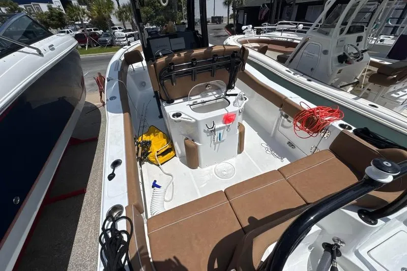 Slide: The Image of 2023 Sea Hunt Ultra 239 SE boat interior with seating and fishing gear. - 15