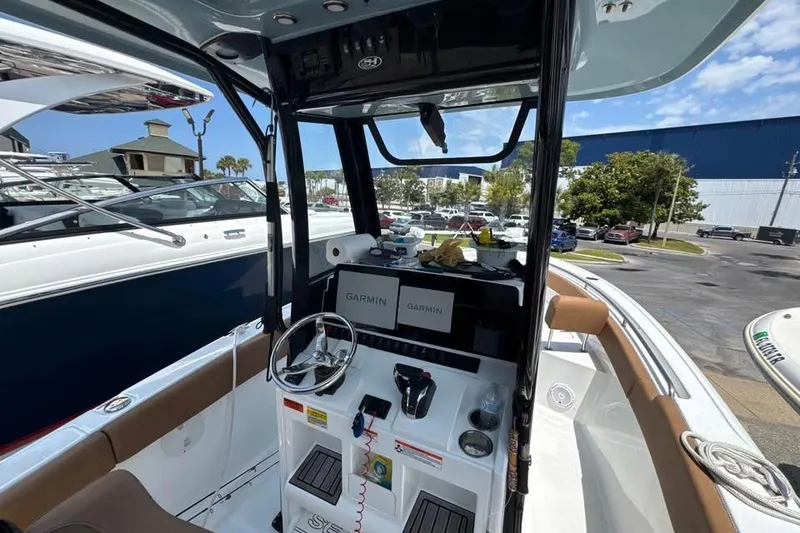 Slide: The Image of Interior view of 2023 Sea Hunt Ultra 239 SE boat with Garmin navigation system. - 16