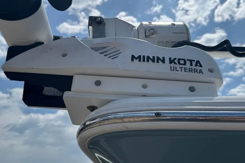 Slide: The Image of Minn Kota Ulterra motor on 2023 Sea Hunt Ultra 239 SE boat under cloudy sky. - 3