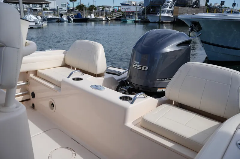 Slide: The Image of 2021 Grady-White Fisherman 216 boat interior with Yamaha 250 engine at marina. - 14