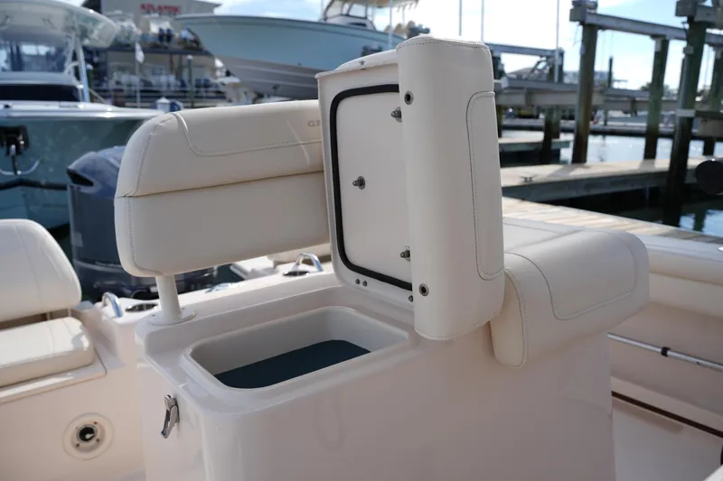 Slide: The Image of 2021 Grady-White Fisherman 216 boat interior with open storage compartment. - 19