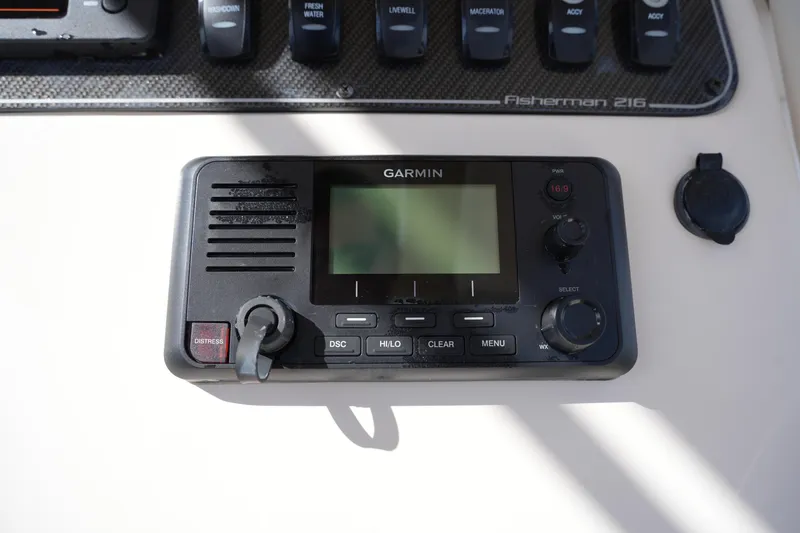 Slide: The Image of Garmin marine radio on 2021 Grady-White Fisherman 216 boat dashboard. - 27