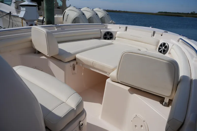 Slide: The Image of 2021 Grady-White Fisherman 216 boat interior with cushioned seating and speakers. - 29