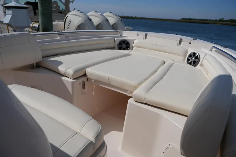 Slide: The Image of 2021 Grady-White Fisherman 216 boat interior with cushioned seating and speakers. - 31