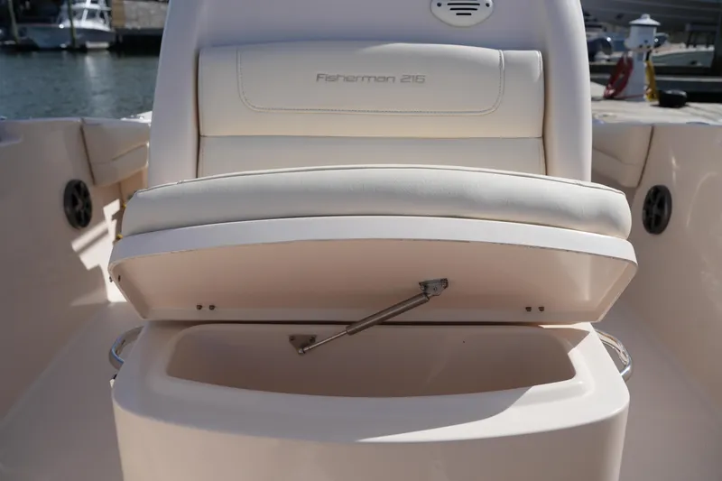 Slide: The Image of 2021 Grady-White Fisherman 216 boat seat with storage compartment open. - 33