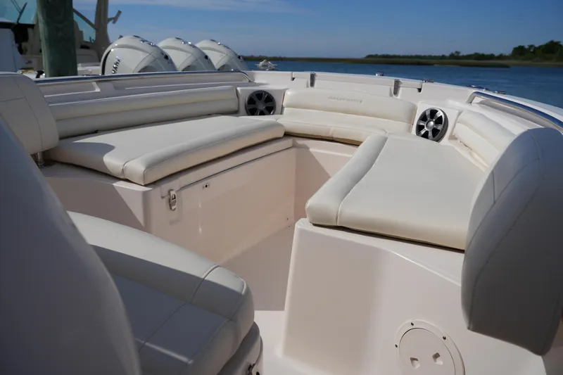 Slide: The Image of 2021 Grady-White Fisherman 216 boat interior with cushioned seating and speakers. - 34