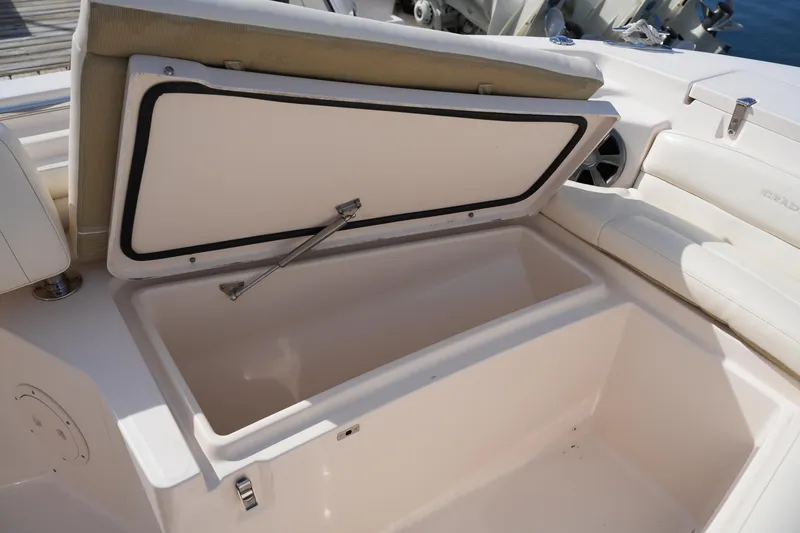 Slide: The Image of Open storage compartment on 2021 Grady-White Fisherman 216 boat, showcasing interior space. - 35