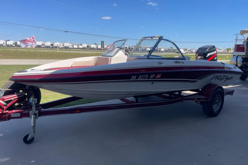 Slide: The Image of 2002 ProCraft 180 Combo boat on trailer, outdoors under clear blue sky. - 3