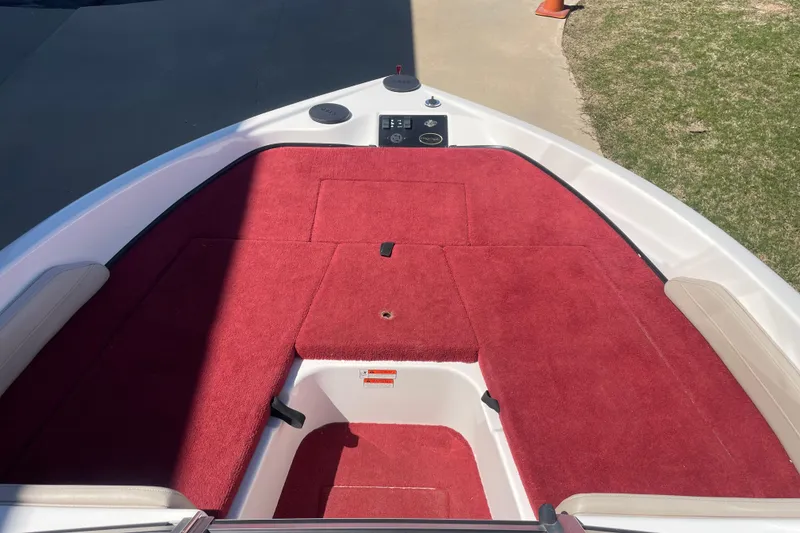 Slide: The Image of Red carpeted deck of a 2002 ProCraft 180 Combo boat. - 7