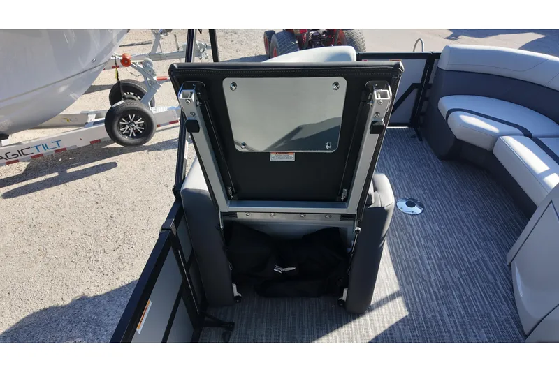 Slide: The Image of 2026 Viaggio Lago X-R 22 boat interior with open storage compartment and seating area. - 12
