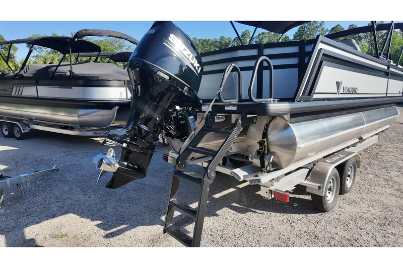 Slide: The Image of 2026 Viaggio Lago X-R 22 pontoon boat with Suzuki outboard motor on trailer. - 2