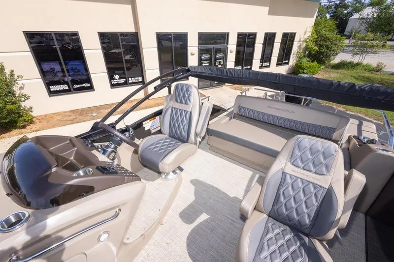 Slide: The Image of 2023 Bennington R23 Swingback boat interior with luxurious seating and modern dashboard. - 10