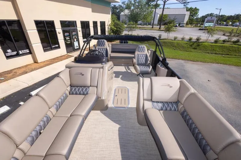 Slide: The Image of 2023 Bennington R23 Swingback pontoon boat with luxurious seating and modern design. - 13