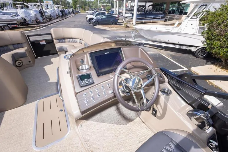 Slide: The Image of 2023 Bennington R23 Swingback boat interior with steering wheel and control panel. - 21
