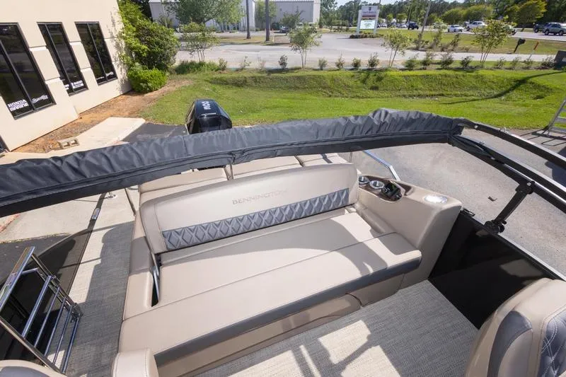 Slide: The Image of 2023 Bennington R23 Swingback boat interior with plush seating and canopy. - 9