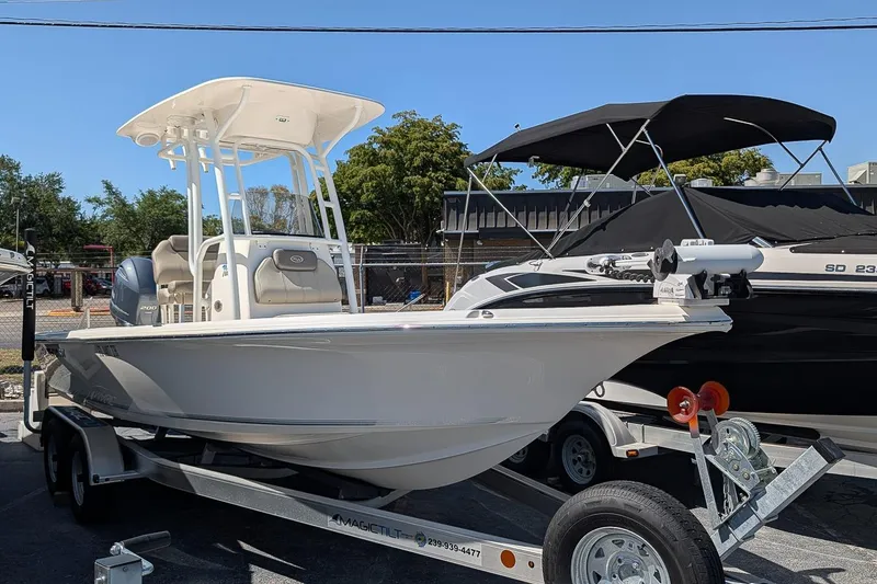 The Image of 2022 Key West 230 Bay Reef boat on trailer, featuring a sleek design and modern amenities. - 0