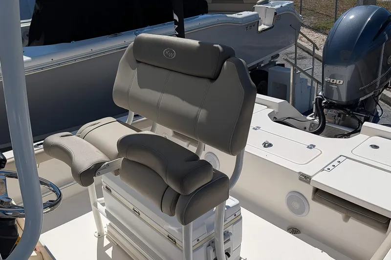 Slide: The Image of 2022 Key West 230 Bay Reef boat with cushioned seating and Yamaha 200 engine. - 13