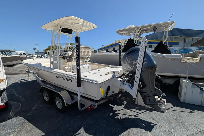 Slide: The Image of 2022 Key West 230 Bay Reef boat on trailer with Yamaha outboard motor. - 2