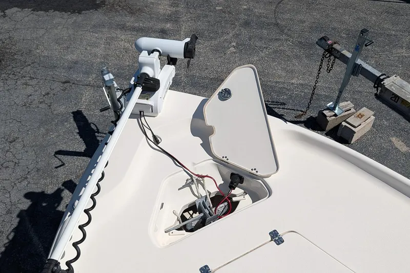 Slide: The Image of 2022 Key West 230 Bay Reef boat with open hatch and trolling motor. - 22