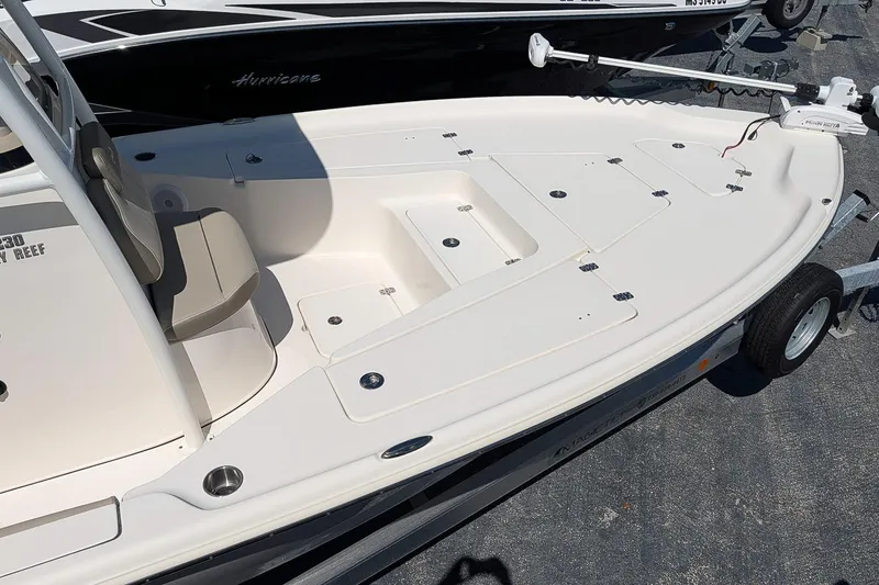 Slide: The Image of 2022 Key West 230 Bay Reef boat with spacious deck and seating. - 5