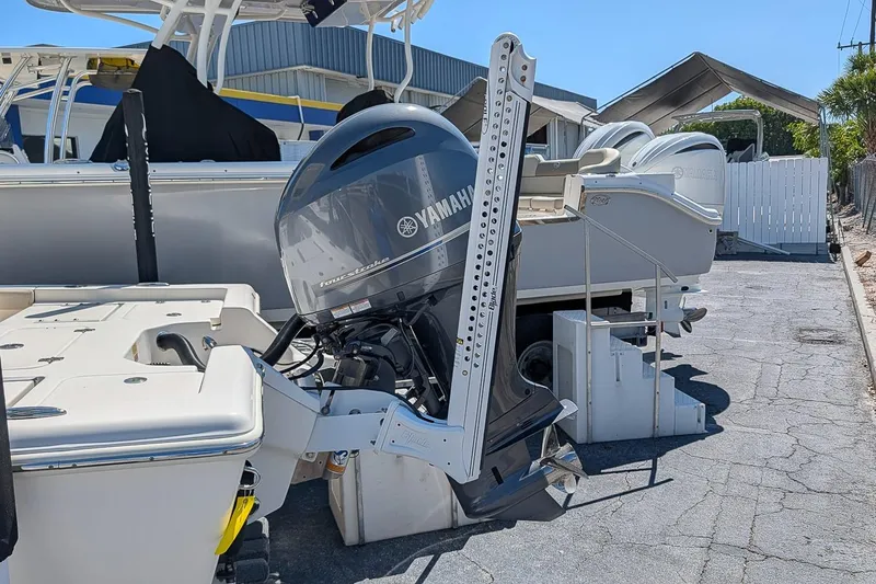 Slide: The Image of 2022 Key West 230 Bay Reef boat with Yamaha outboard motor in a marina setting. - 6