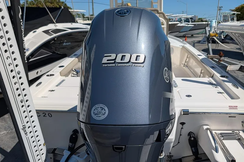Slide: The Image of 2022 Key West 230 Bay Reef boat with Yamaha 200 engine, displayed outdoors. - 8