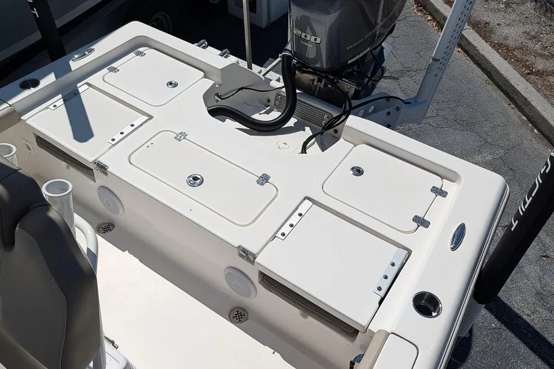 Slide: The Image of 2022 Key West 230 Bay Reef boat deck with storage compartments and Yamaha outboard motor. - 9