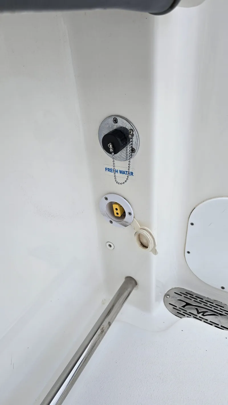 Slide: The Image of Tidewater 280 CC Adventure 2018, freshwater connection and outlet. - 15