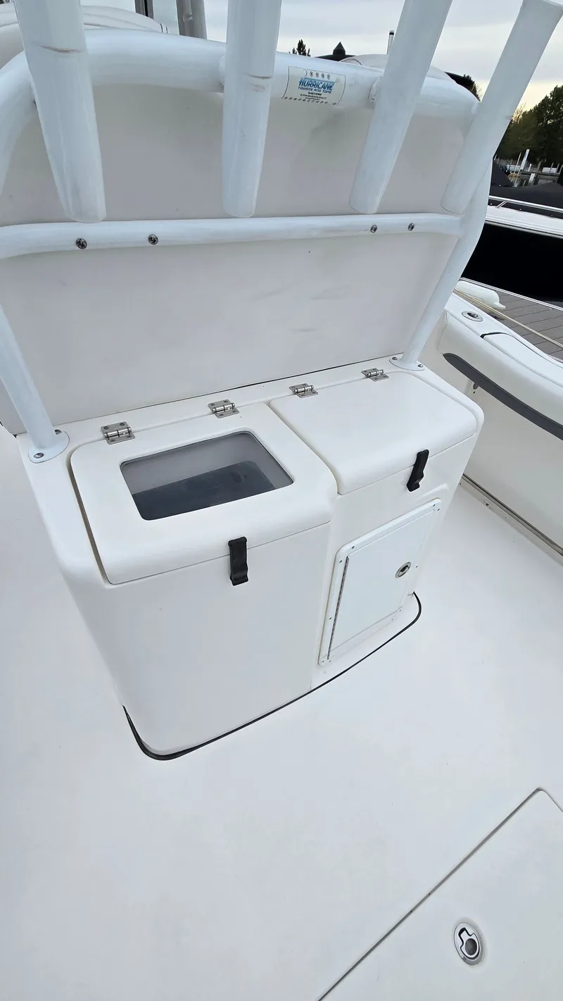 Slide: The Image of Tidewater 280 CC Adventure 2018 boat console with storage compartments. - 16