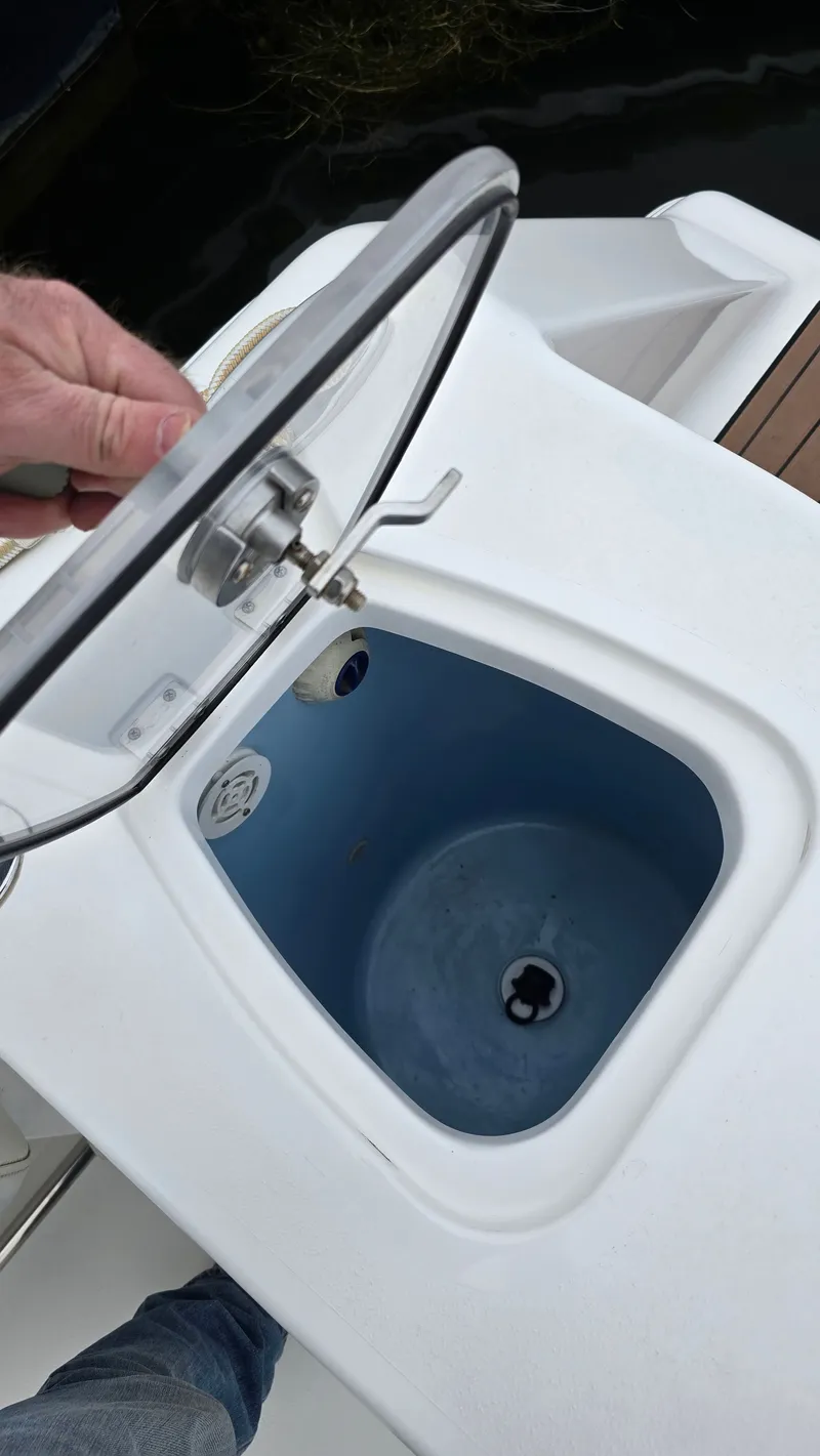 Slide: The Image of Tidewater 280 CC Adventure 2018 with open storage compartment lid. - 17