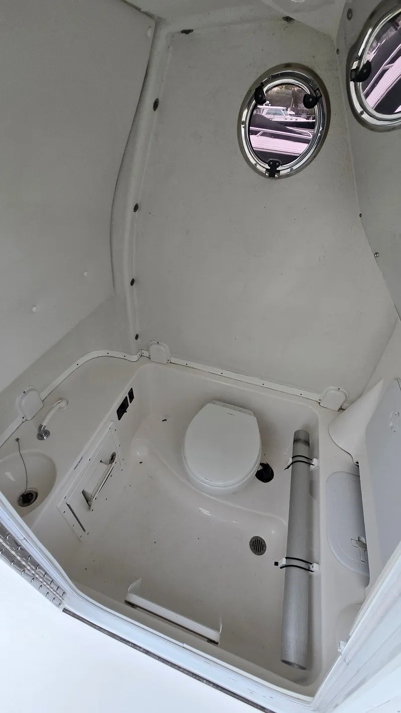 Slide: The Image of Interior of 2018 Tidewater 280 CC Adventure with toilet and portholes. - 18