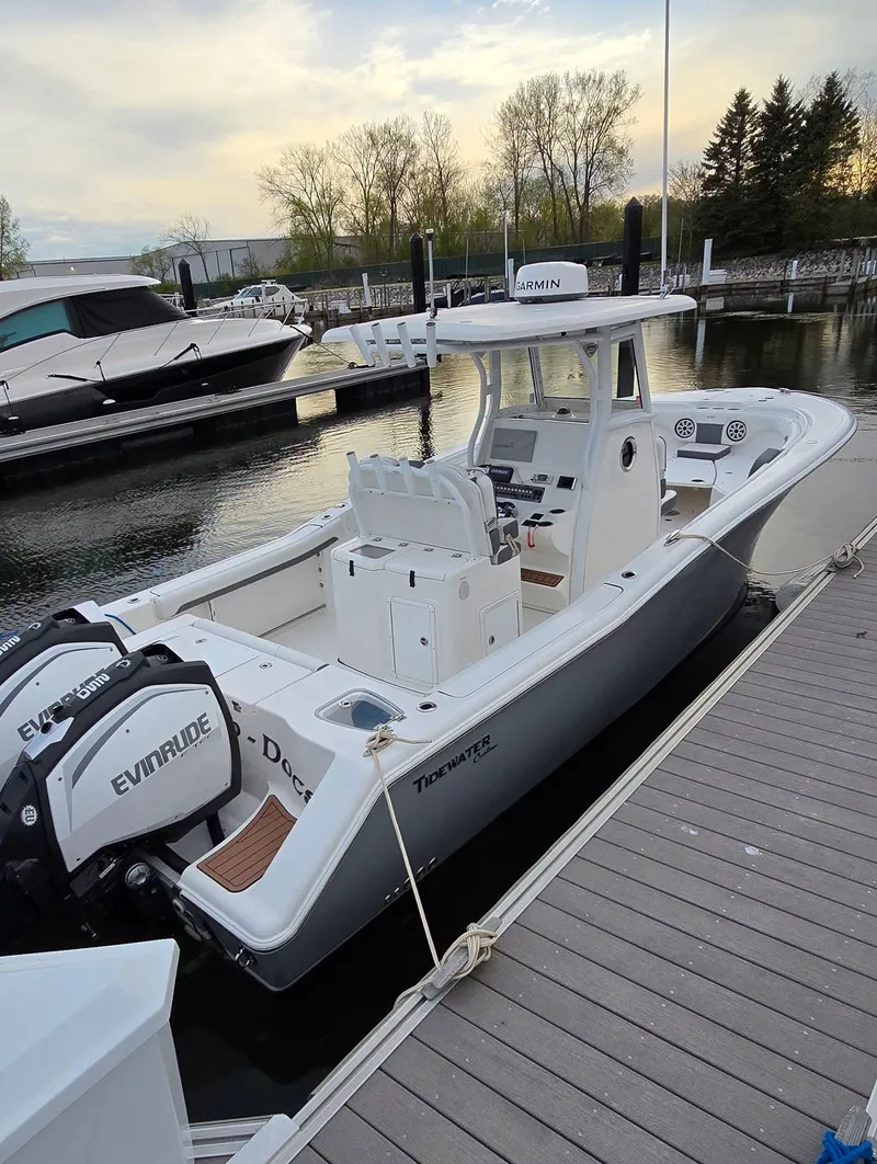 Slide: The Image of 2018 Tidewater 280 CC Adventure boat docked at marina. - 3