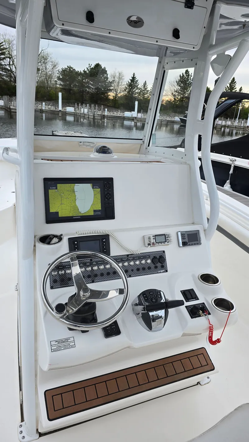 Slide: The Image of 2018 Tidewater 280 CC Adventure helm with navigation system. - 7