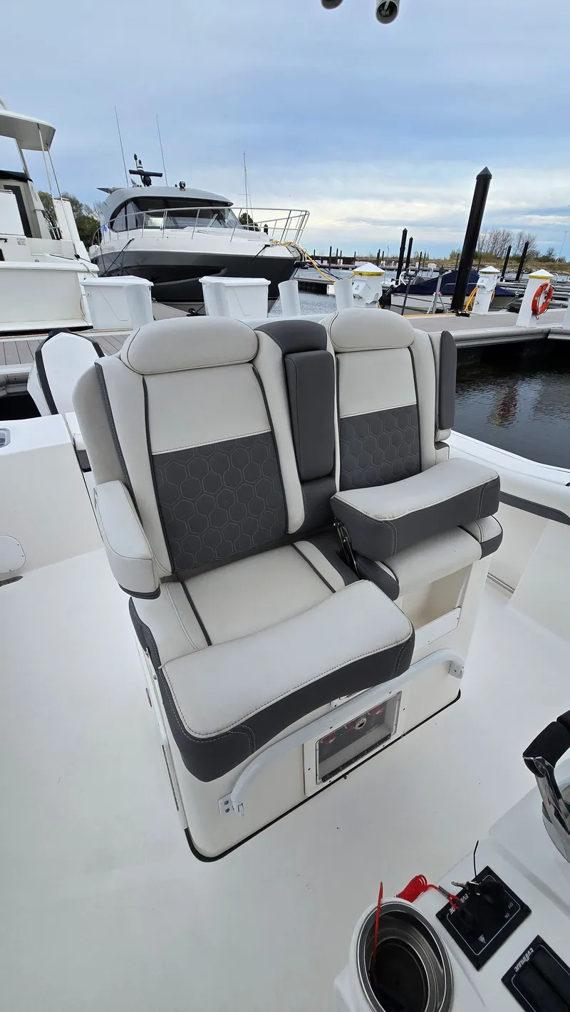 Slide: The Image of Tidewater 280 CC Adventure 2018 boat seats at the marina. - 9