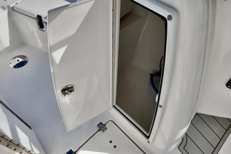 Slide: The Image of Open storage compartment on 2024 Sea Fox 228 Commander boat, showcasing interior space. - 10