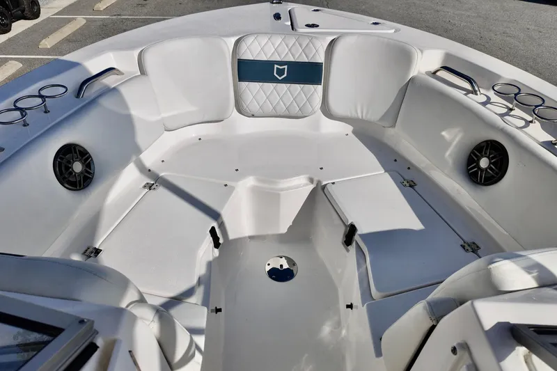 Slide: The Image of 2024 Sea Fox 228 Commander boat interior with cushioned seating and cup holders. - 14