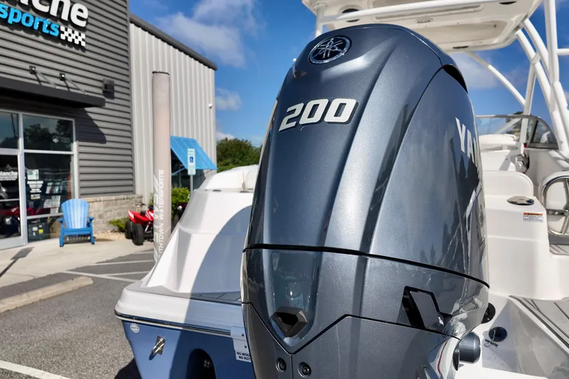 Slide: The Image of 2024 Sea Fox 228 Commander with Yamaha 200 engine at a dealership. - 15
