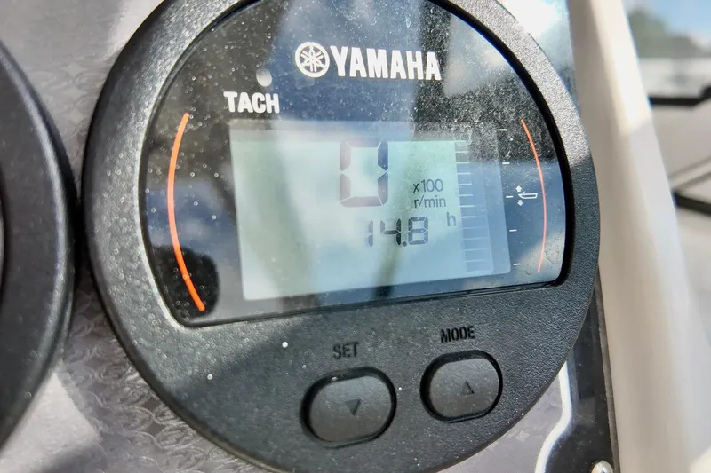 Slide: The Image of Yamaha tachometer display on 2024 Sea Fox 228 Commander boat, showing 14.8 hours. - 21