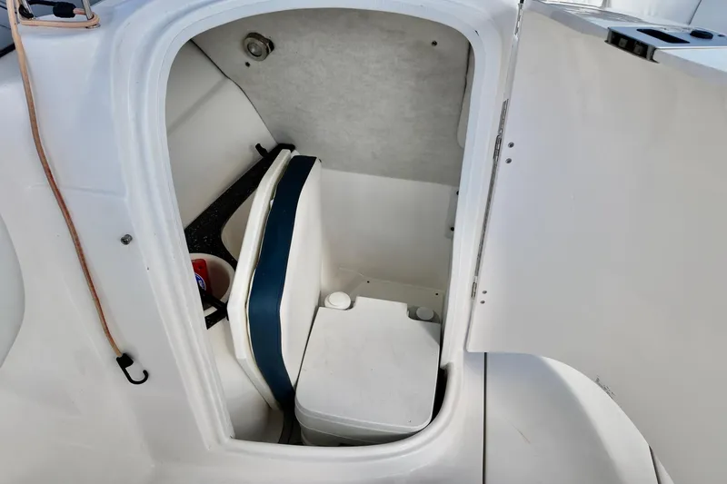 Slide: The Image of 2024 Sea Fox 228 Commander boat interior with compact marine toilet. - 5