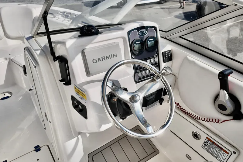 Slide: The Image of 2024 Sea Fox 228 Commander boat dashboard with Garmin navigation system and steering wheel. - 8