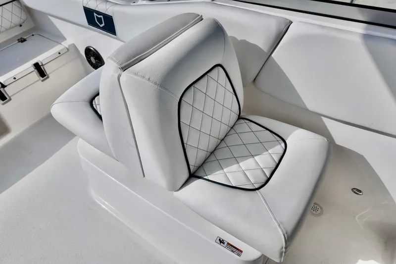 Slide: The Image of 2024 Sea Fox 228 Commander boat seat with white and black diamond stitching. - 9
