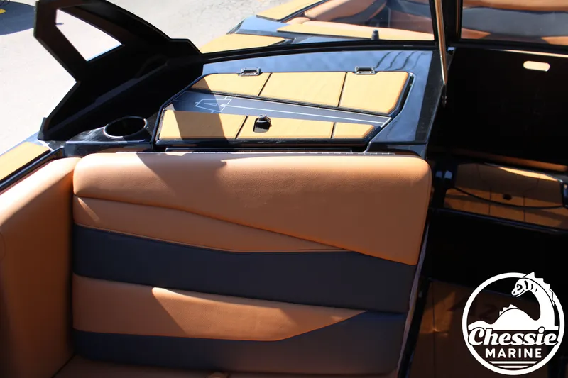 Slide: The Image of Interior of a 2026 Axis A225 boat with brown leather seats. - 19