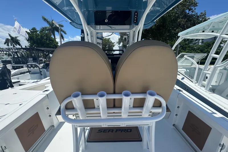 Slide: The Image of 2026 Sea Pro 242 Center Console with seating and rod holders. - 10